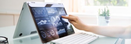 A tablet screen displaying multiple charts.