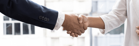 A handshake between two professionals.